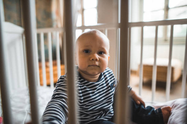 istock little kid in the crib at home 2181895399