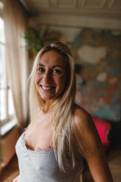 istock smiling woman at home 2181896955