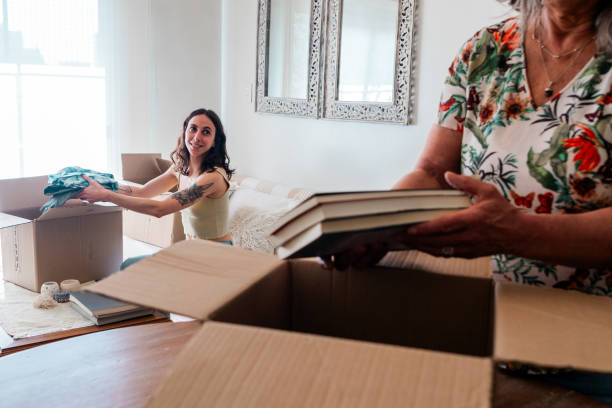 istock Daughter talking with mother during moving house 2181896982