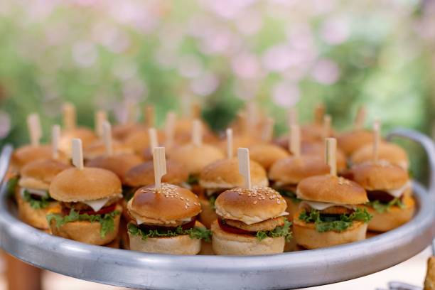 istock Mini burgers on a tray with garden backdrop 2181898683