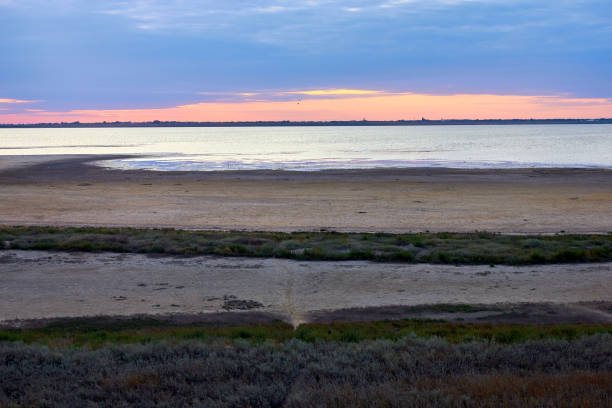 istock Sunset sky over the lake and alkali soils 2181899795