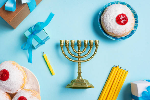 istock Hanukkah composition with Menorah and sufganiyah jelly donuts 2181899804
