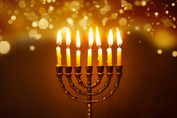 istock Hanukkah Menorah with burning candles 2181899967
