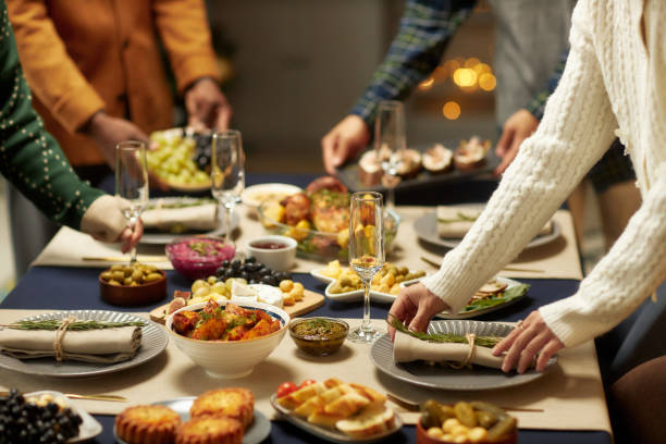 istock Female Hands Serving Festive Table with Champagne Flutes for Christmas Dinner 2181900265