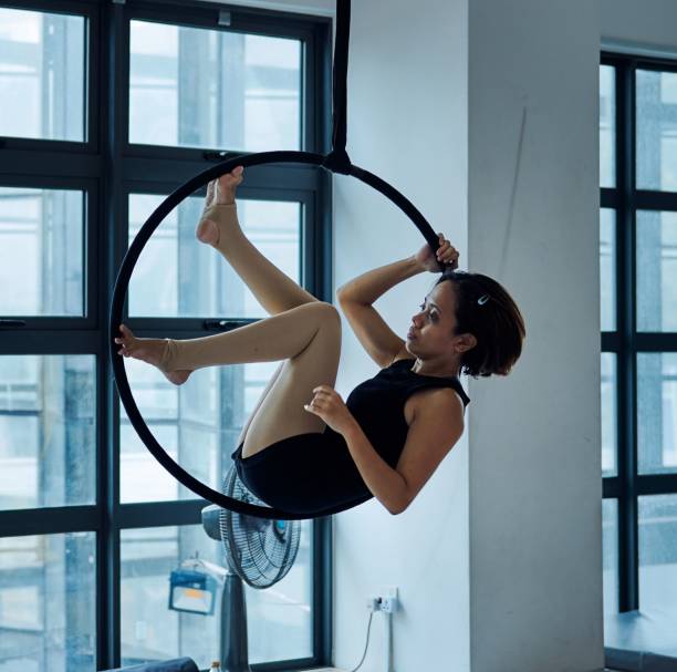 istock Young woman practicing aerial hoop in studio. 2181900441