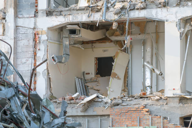 Demolition of a building. The wreckage of a demolished building.