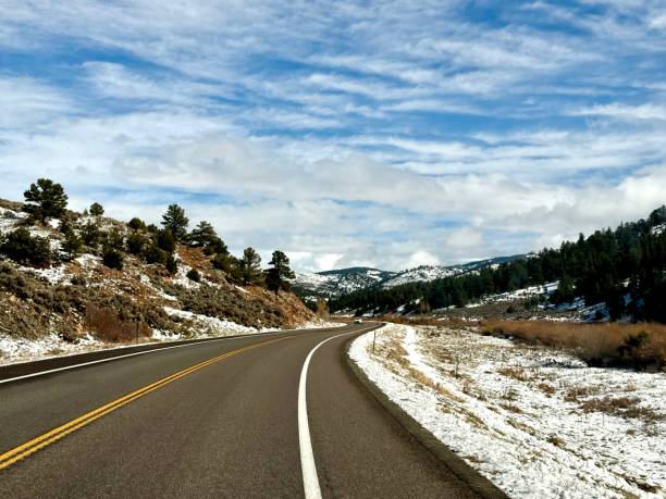 istock Windy Mountain Road with a new layer of snow 2181903563