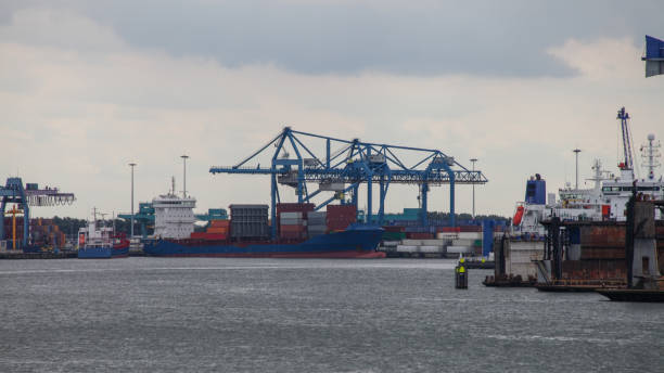 istock Cargo container ship at a container terminal in Rotterdam port, Netherlands 2181904854