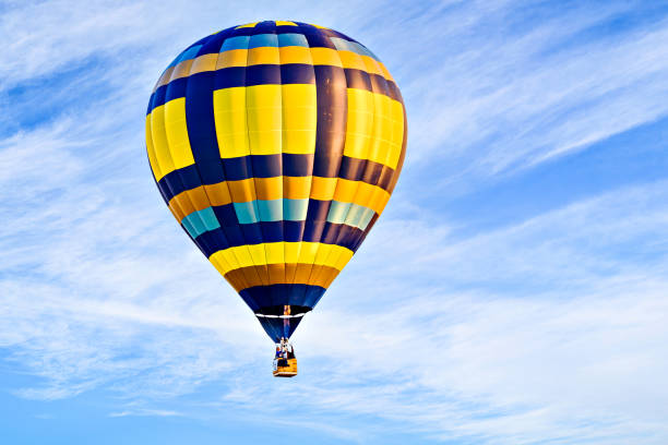 istock Hot air balloon flight over blue sky 2181905118