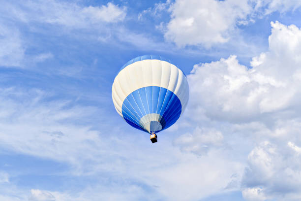 istock Hot air balloon flight over blue sky 2181905123