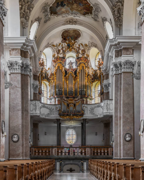 The exquisite and magnificent interior of the St, Mang Abbey in Füssen The monastery and the former Basilica of St. Mang date back to St. Magnus, an Irish missionary from the monastery of St. Gallen who worked in the Allgäu in the 8th century. Above his cell was the first church, which was extended and built over in the course of the centuries. The church was extended to its present size between the 11th and 14th centuries. The tower dates from 1200 and was ravaged and looted in the Thirty Years’ War, St. Mang was rebuilt in the Italian Baroque style by Johann Jakob Herkomer at the beginning of the 18th century. A light-flooded room, frescoes and marble characterize this style. The text was writen by myself st mang stock pictures, royalty-free photos & images