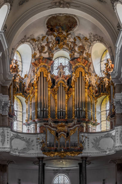 The exquisite and magnificent interior of the St, Mang Abbey in Füssen The monastery and the former Basilica of St. Mang date back to St. Magnus, an Irish missionary from the monastery of St. Gallen who worked in the Allgäu in the 8th century. Above his cell was the first church, which was extended and built over in the course of the centuries. The church was extended to its present size between the 11th and 14th centuries. The tower dates from 1200 and was ravaged and looted in the Thirty Years’ War, St. Mang was rebuilt in the Italian Baroque style by Johann Jakob Herkomer at the beginning of the 18th century. A light-flooded room, frescoes and marble characterize this style. The text was writen by myself st mang stock pictures, royalty-free photos & images