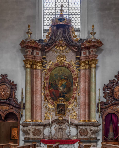 The exquisite and magnificent interior of the St, Mang Abbey in Füssen The monastery and the former Basilica of St. Mang date back to St. Magnus, an Irish missionary from the monastery of St. Gallen who worked in the Allgäu in the 8th century. Above his cell was the first church, which was extended and built over in the course of the centuries. The church was extended to its present size between the 11th and 14th centuries. The tower dates from 1200 and was ravaged and looted in the Thirty Years’ War, St. Mang was rebuilt in the Italian Baroque style by Johann Jakob Herkomer at the beginning of the 18th century. A light-flooded room, frescoes and marble characterize this style. The text was writen by myself st mang stock pictures, royalty-free photos & images