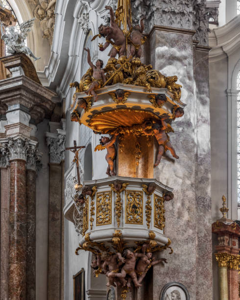The exquisite and magnificent interior of the St, Mang Abbey in Füssen The monastery and the former Basilica of St. Mang date back to St. Magnus, an Irish missionary from the monastery of St. Gallen who worked in the Allgäu in the 8th century. Above his cell was the first church, which was extended and built over in the course of the centuries. The church was extended to its present size between the 11th and 14th centuries. The tower dates from 1200 and was ravaged and looted in the Thirty Years’ War, St. Mang was rebuilt in the Italian Baroque style by Johann Jakob Herkomer at the beginning of the 18th century. A light-flooded room, frescoes and marble characterize this style. The text was writen by myself st mang stock pictures, royalty-free photos & images