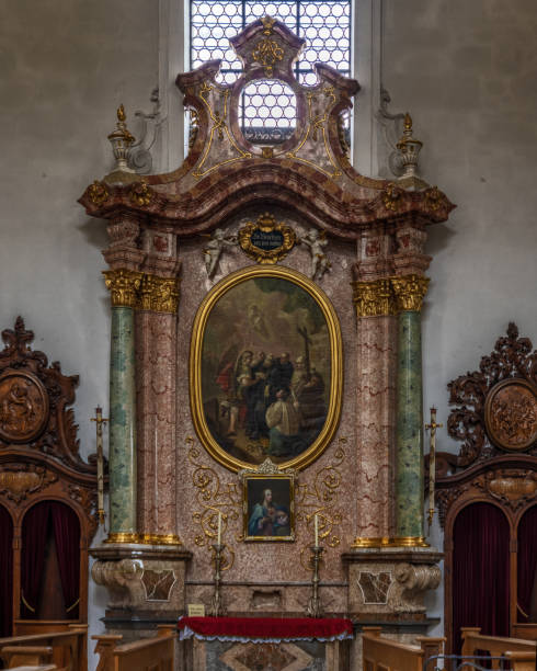 The exquisite and magnificent interior of the St, Mang Abbey in Füssen The monastery and the former Basilica of St. Mang date back to St. Magnus, an Irish missionary from the monastery of St. Gallen who worked in the Allgäu in the 8th century. Above his cell was the first church, which was extended and built over in the course of the centuries. The church was extended to its present size between the 11th and 14th centuries. The tower dates from 1200 and was ravaged and looted in the Thirty Years’ War, St. Mang was rebuilt in the Italian Baroque style by Johann Jakob Herkomer at the beginning of the 18th century. A light-flooded room, frescoes and marble characterize this style. The text was writen by myself st mang stock pictures, royalty-free photos & images