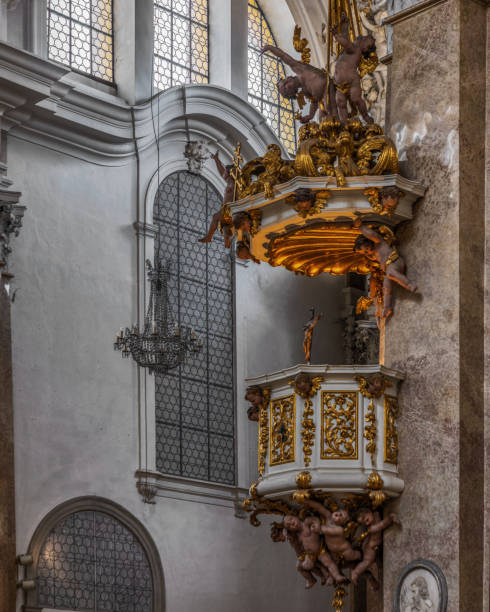 The exquisite and magnificent interior of the St, Mang Abbey in Füssen The monastery and the former Basilica of St. Mang date back to St. Magnus, an Irish missionary from the monastery of St. Gallen who worked in the Allgäu in the 8th century. Above his cell was the first church, which was extended and built over in the course of the centuries. The church was extended to its present size between the 11th and 14th centuries. The tower dates from 1200 and was ravaged and looted in the Thirty Years’ War, St. Mang was rebuilt in the Italian Baroque style by Johann Jakob Herkomer at the beginning of the 18th century. A light-flooded room, frescoes and marble characterize this style. The text was writen by myself st mang stock pictures, royalty-free photos & images