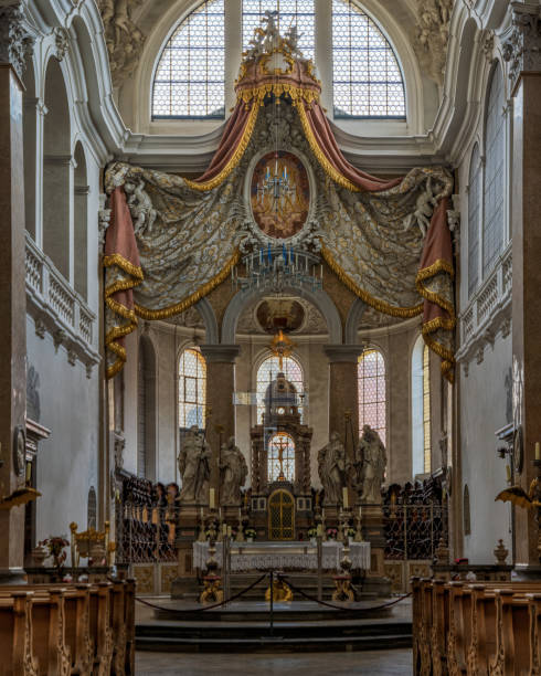 The exquisite and magnificent interior of the St, Mang Abbey in Füssen The monastery and the former Basilica of St. Mang date back to St. Magnus, an Irish missionary from the monastery of St. Gallen who worked in the Allgäu in the 8th century. Above his cell was the first church, which was extended and built over in the course of the centuries. The church was extended to its present size between the 11th and 14th centuries. The tower dates from 1200 and was ravaged and looted in the Thirty Years’ War, St. Mang was rebuilt in the Italian Baroque style by Johann Jakob Herkomer at the beginning of the 18th century. A light-flooded room, frescoes and marble characterize this style. The text was writen by myself st mang stock pictures, royalty-free photos & images