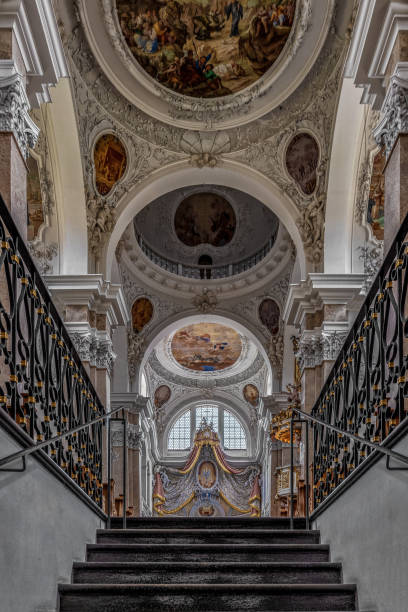 The exquisite and magnificent interior of the St, Mang Abbey in Füssen The monastery and the former Basilica of St. Mang date back to St. Magnus, an Irish missionary from the monastery of St. Gallen who worked in the Allgäu in the 8th century. Above his cell was the first church, which was extended and built over in the course of the centuries. The church was extended to its present size between the 11th and 14th centuries. The tower dates from 1200 and was ravaged and looted in the Thirty Years’ War, St. Mang was rebuilt in the Italian Baroque style by Johann Jakob Herkomer at the beginning of the 18th century. A light-flooded room, frescoes and marble characterize this style. The text was writen by myself st mang stock pictures, royalty-free photos & images