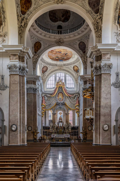 The exquisite and magnificent interior of the St, Mang Abbey in Füssen The monastery and the former Basilica of St. Mang date back to St. Magnus, an Irish missionary from the monastery of St. Gallen who worked in the Allgäu in the 8th century. Above his cell was the first church, which was extended and built over in the course of the centuries. The church was extended to its present size between the 11th and 14th centuries. The tower dates from 1200 and was ravaged and looted in the Thirty Years’ War, St. Mang was rebuilt in the Italian Baroque style by Johann Jakob Herkomer at the beginning of the 18th century. A light-flooded room, frescoes and marble characterize this style. The text was writen by myself st mang stock pictures, royalty-free photos & images