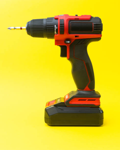 istock Modern wireless electric screwdriver on a yellow background 2181907255