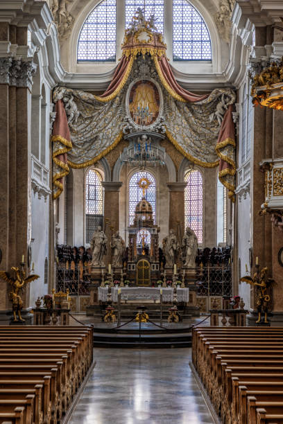 The exquisite and magnificent interior of the St, Mang Abbey in Füssen The monastery and the former Basilica of St. Mang date back to St. Magnus, an Irish missionary from the monastery of St. Gallen who worked in the Allgäu in the 8th century. Above his cell was the first church, which was extended and built over in the course of the centuries. The church was extended to its present size between the 11th and 14th centuries. The tower dates from 1200 and was ravaged and looted in the Thirty Years’ War, St. Mang was rebuilt in the Italian Baroque style by Johann Jakob Herkomer at the beginning of the 18th century. A light-flooded room, frescoes and marble characterize this style. The text was writen by myself st mang stock pictures, royalty-free photos & images