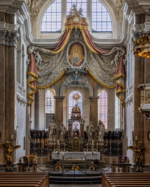 The exquisite and magnificent interior of the St, Mang Abbey in Füssen The monastery and the former Basilica of St. Mang date back to St. Magnus, an Irish missionary from the monastery of St. Gallen who worked in the Allgäu in the 8th century. Above his cell was the first church, which was extended and built over in the course of the centuries. The church was extended to its present size between the 11th and 14th centuries. The tower dates from 1200 and was ravaged and looted in the Thirty Years’ War, St. Mang was rebuilt in the Italian Baroque style by Johann Jakob Herkomer at the beginning of the 18th century. A light-flooded room, frescoes and marble characterize this style. The text was writen by myself st mang stock pictures, royalty-free photos & images