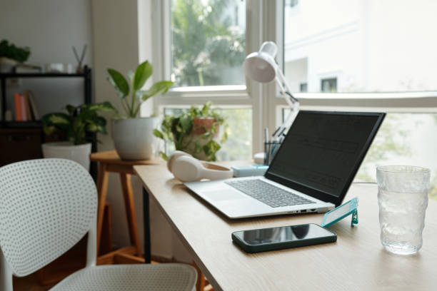 istock Modern Home Office Workspace with Laptop and Plants 2181908000