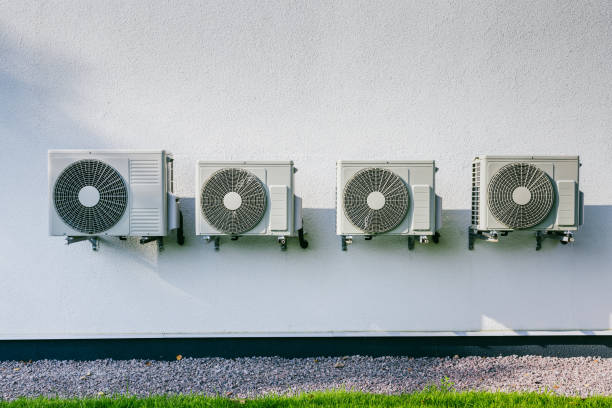istock Air conditioner compressor installed in modern house. Air conditioning unit or compressor installed outside a building 2181908042