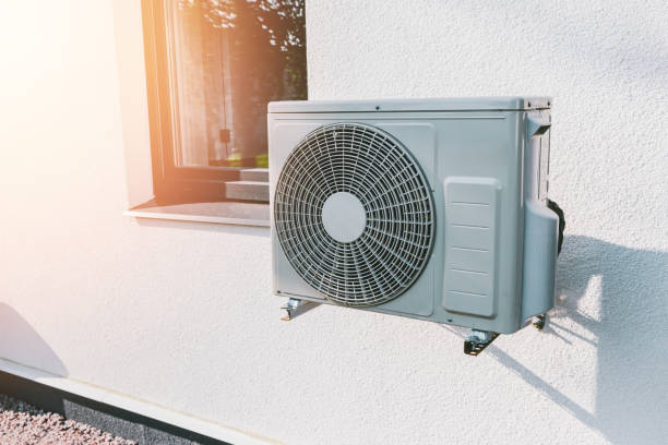 istock Air conditioner compressor installed in modern house. Air conditioning unit or compressor installed outside a building 2181908063