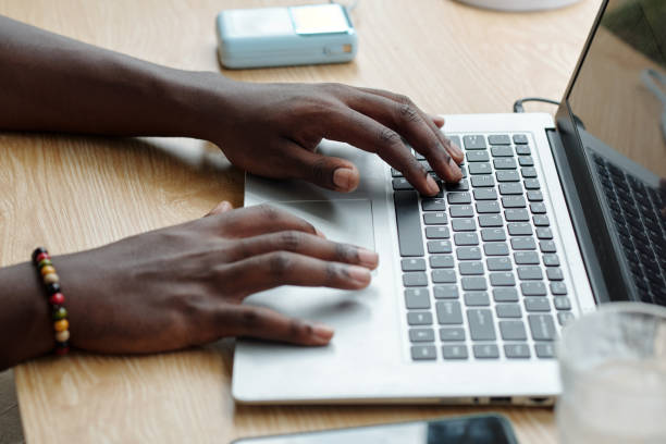 istock Typing on Laptop in Casual Setting with Accessories 2181908068