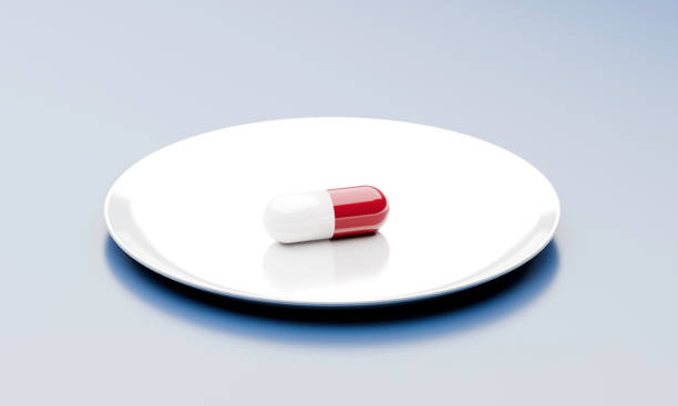 istock Single Capsule on White Plate: Minimalist Medical Concept 2181908680
