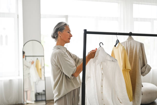 istock Natural fabric blouses. Clothing store owner. 2181911680