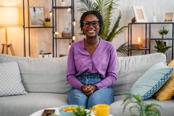 istock Young Woman Sitting On The Sofa At Home 2181912808