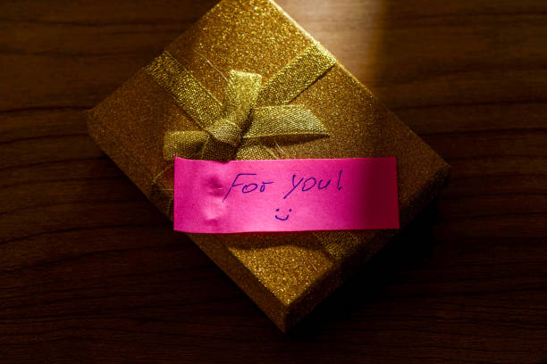 istock A ray of light illuminates the note For you on the gift box. 2181917670