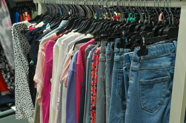 istock clothes in the store are hanging on hangers 2181918916