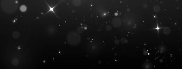 istock Christmas multicolored glowing glowing confetti and sparks. Shimmering dust. Bokeh lights. Holiday designs. Light of white dust. Bokeh light effect background. Christmas background of shining dust. 2181920695