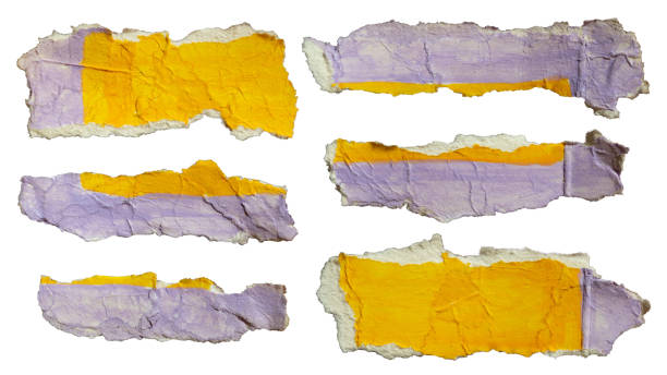 istock Torn papers with yellow and purple paint 2181921551