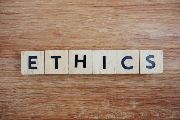 istock ETHICS alphabet letters top view on wooden background 2181922288