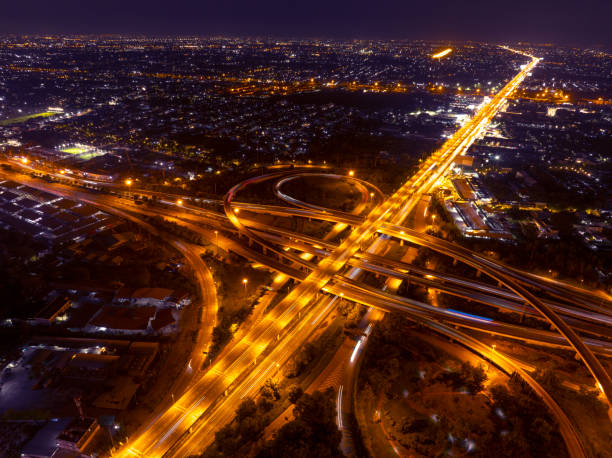 istock Expressway top view, Road traffic an important infrastructure, Drone aerial view fly in circle, traffic transportation, Public transport or commuter city life concept of economic and energ, transport. 2181926909