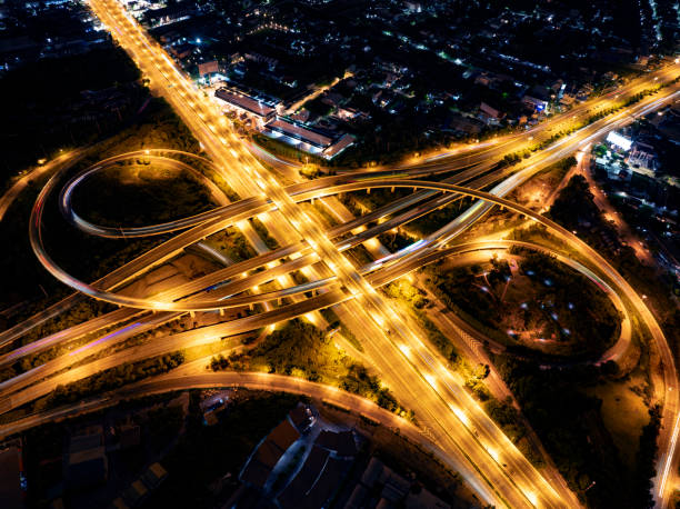 istock Expressway top view, Road traffic an important infrastructure, Drone aerial view fly in circle, traffic transportation, Public transport or commuter city life concept of economic and energ, transport. 2181926918