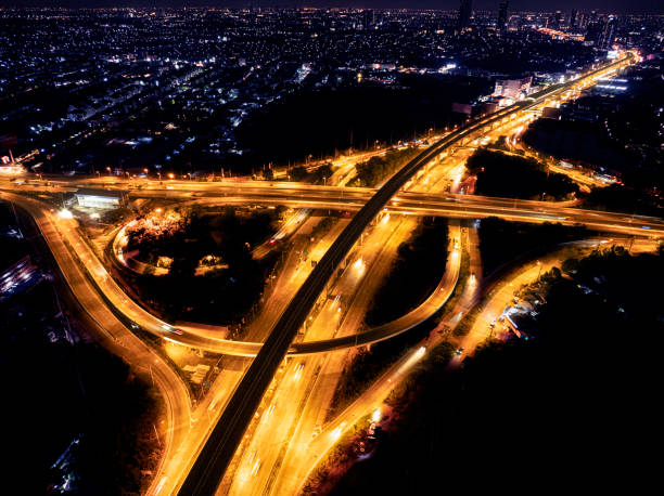 istock Expressway top view, Road traffic an important infrastructure, Drone aerial view fly in circle, traffic transportation, Public transport or commuter city life concept of economic and energ, transport. 2181926954