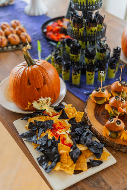 istock Halloween-themed catering served on a table at a costume party 2181927042