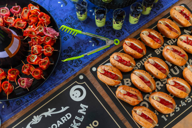 Halloween-themed catering served on a table at a costume party