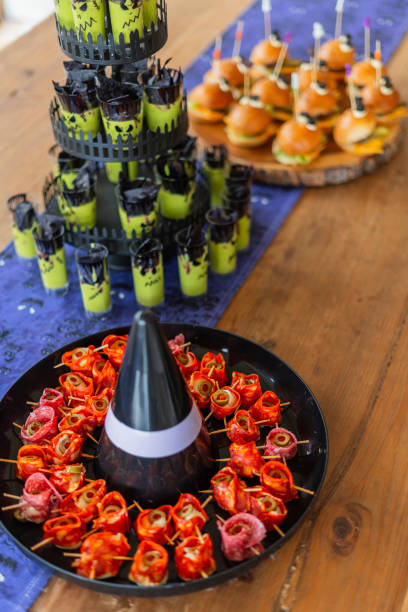 istock Halloween-themed catering served on a table at a costume party 2181928122
