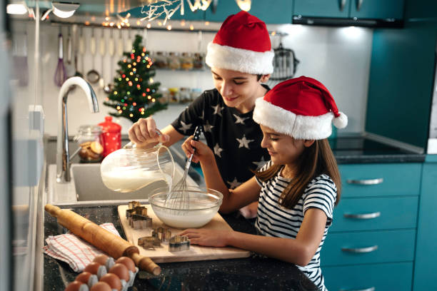 istock Pouring milk into a mixing bowl for holiday baking fun 2181928637