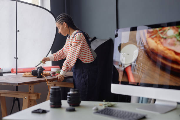 istock Black Woman Setting Up Equipment in Studio 2181930191