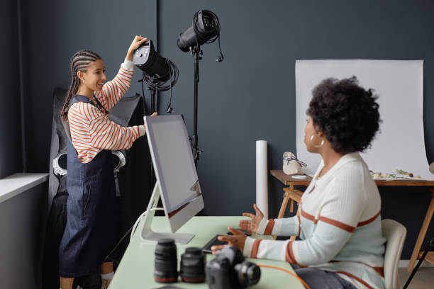 istock Two Black Young Women Working in Photo Studio 2181930333