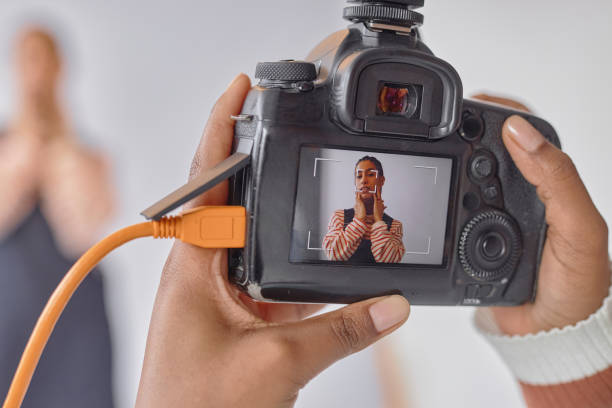 istock Photographer Holding Camera with Portrait on Screen 2181930942