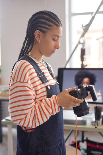 istock Gen Z Young Woman as Photographer Side View 2181930971