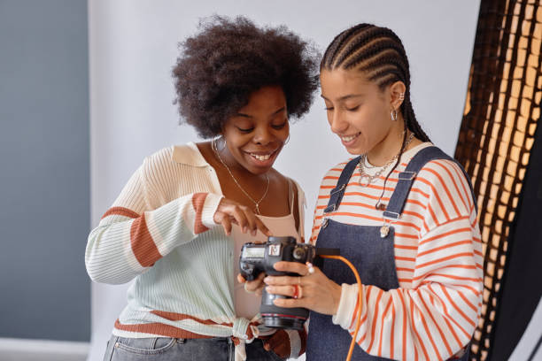 istock Girls Looking at Photos in Camera 2181930986